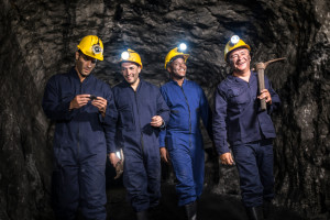 Group of miners mining underground